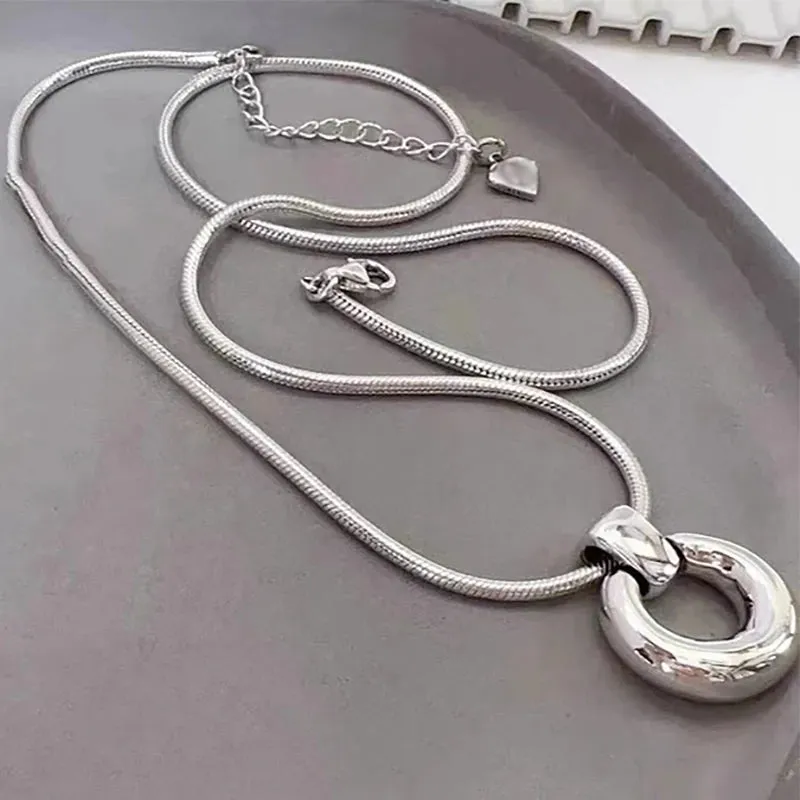 VAIGE Elegant Hollow Round Pendant Necklace in Silver and Gold